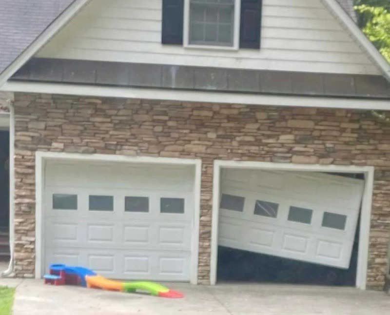 A garage door off its tracks, the kind of call we take